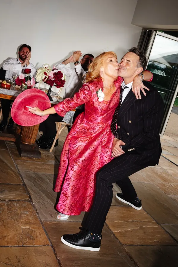 A toast going up at a wedding table
